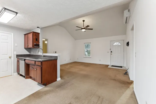 a kitchen with stainless steel appliances granite countertop a stove and a sink