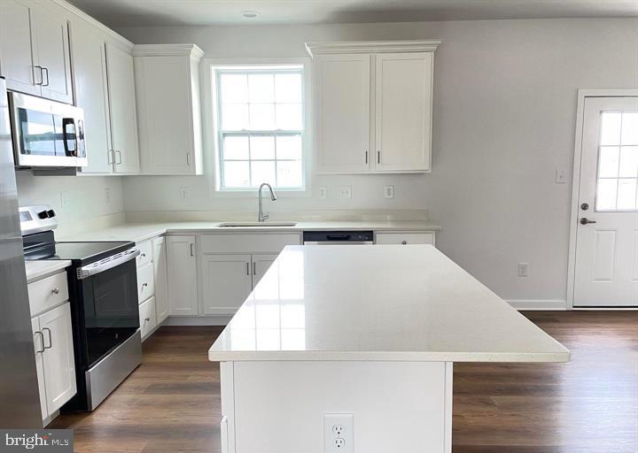 12 Glenaire Road Bunker Hill, WV 25413 - Photo 2 of 31 a kitchen with a sink a stove and cabinets