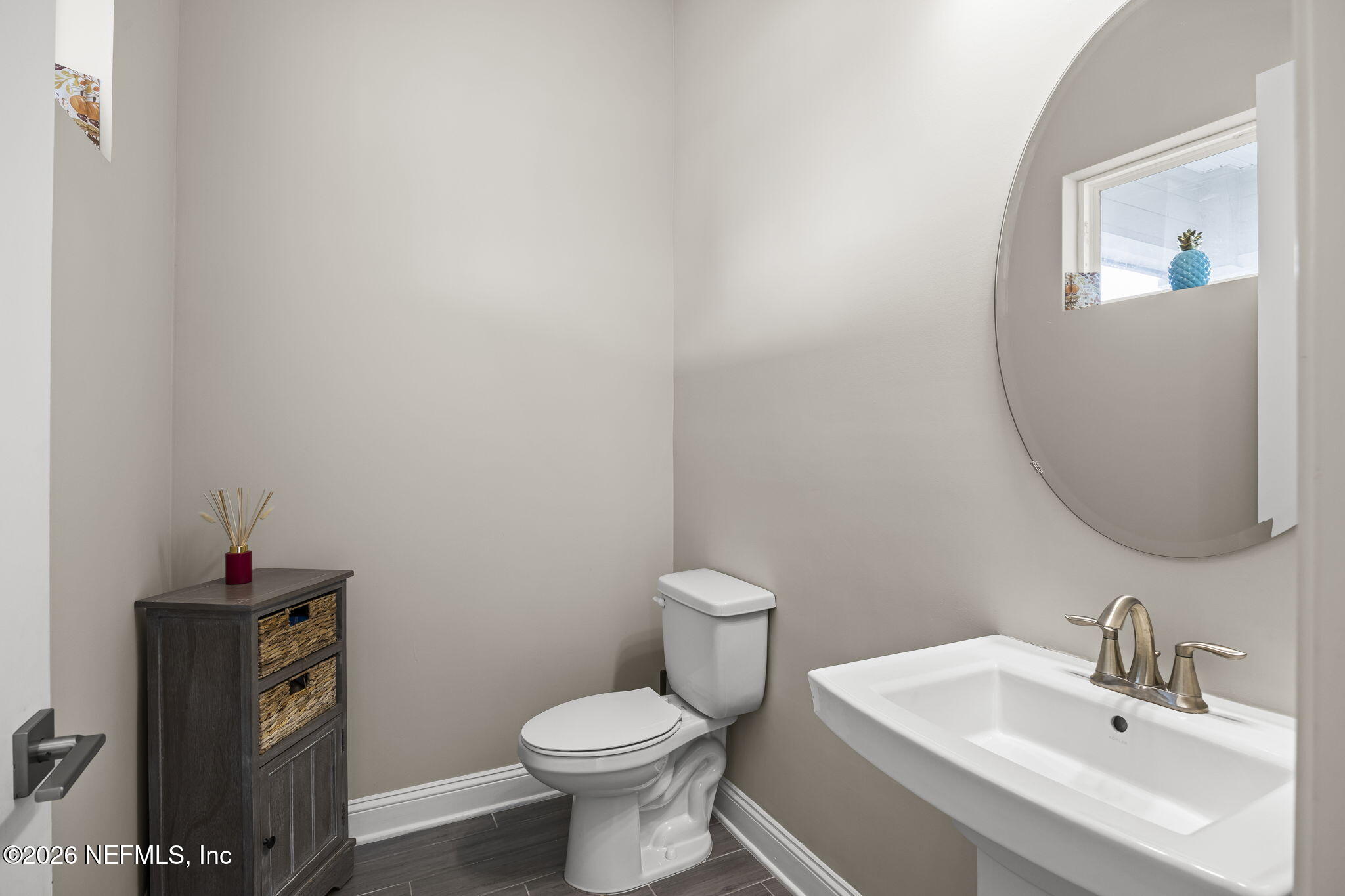 385 Rum Runner Way St. Johns, FL 32259 - Photo 11 of 35 a bathroom with a toilet sink and mirror