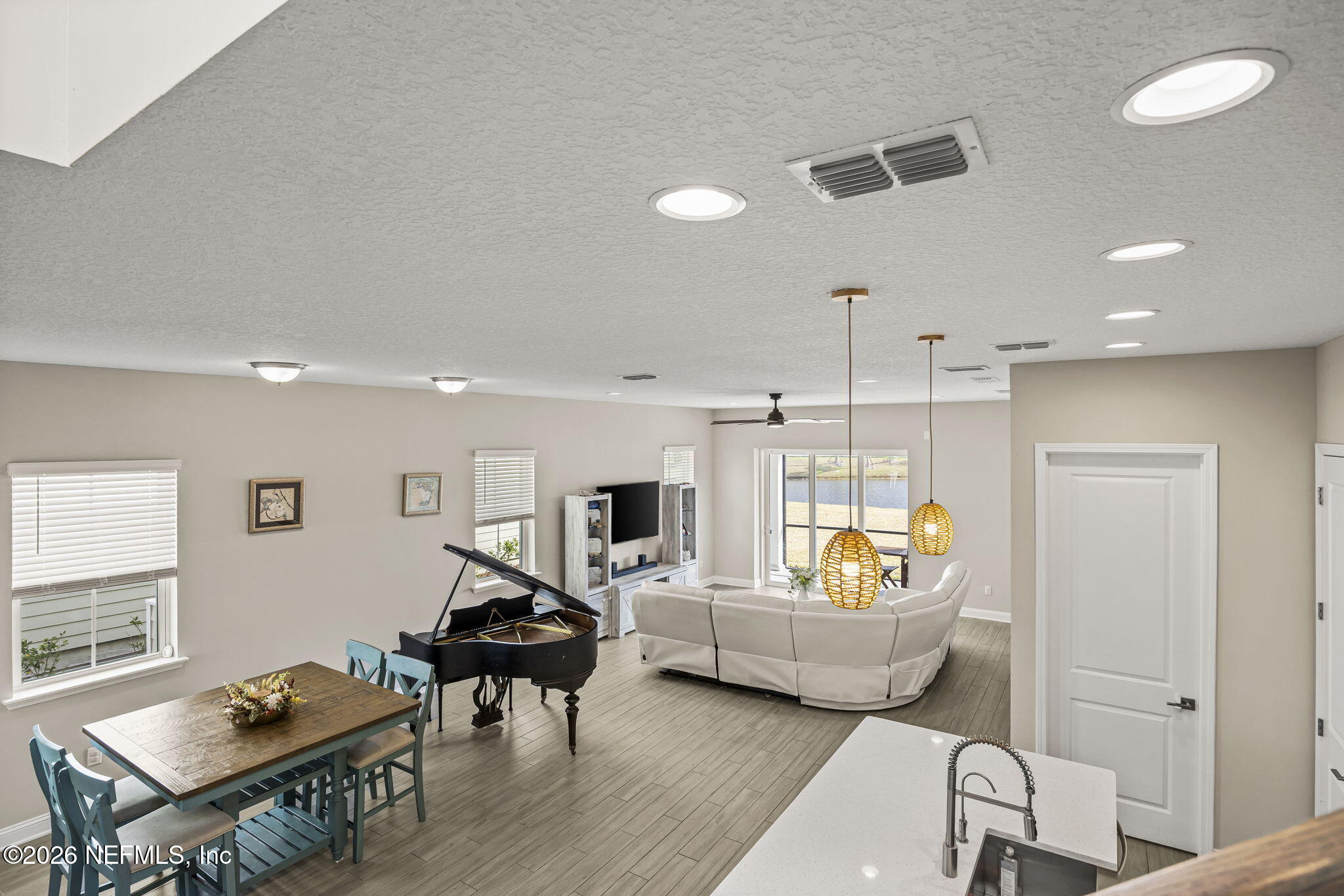 385 Rum Runner Way St. Johns, FL 32259 - Photo 12 of 35 a living room with furniture and a wooden floor