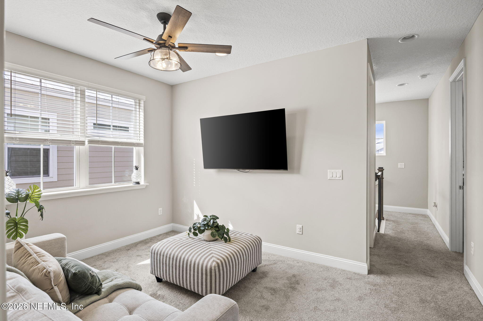385 Rum Runner Way St. Johns, FL 32259 - Photo 14 of 35 a living room with furniture and a flat screen tv