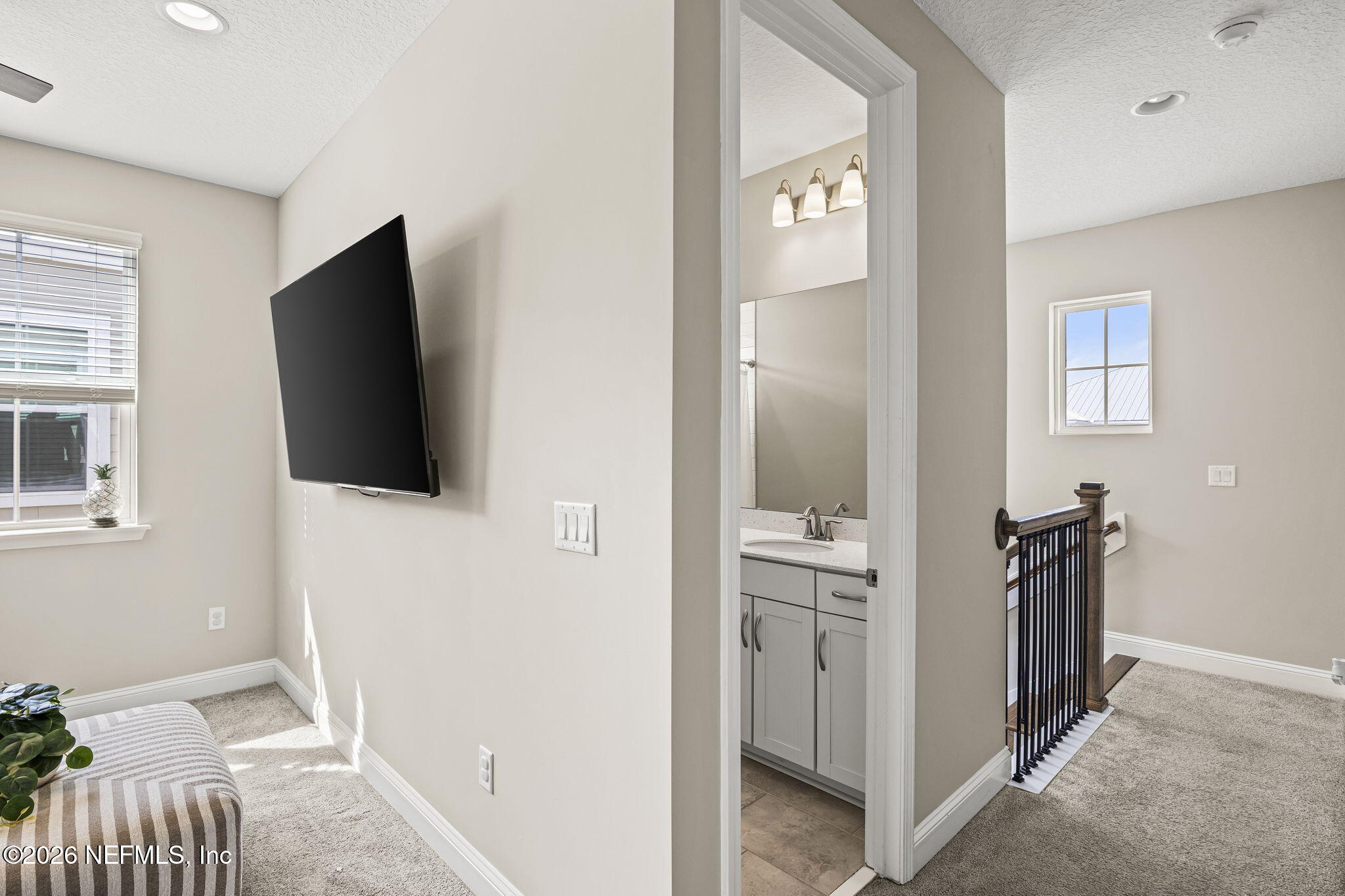 385 Rum Runner Way St. Johns, FL 32259 - Photo 15 of 35 a view of a livingroom with a flat screen tv