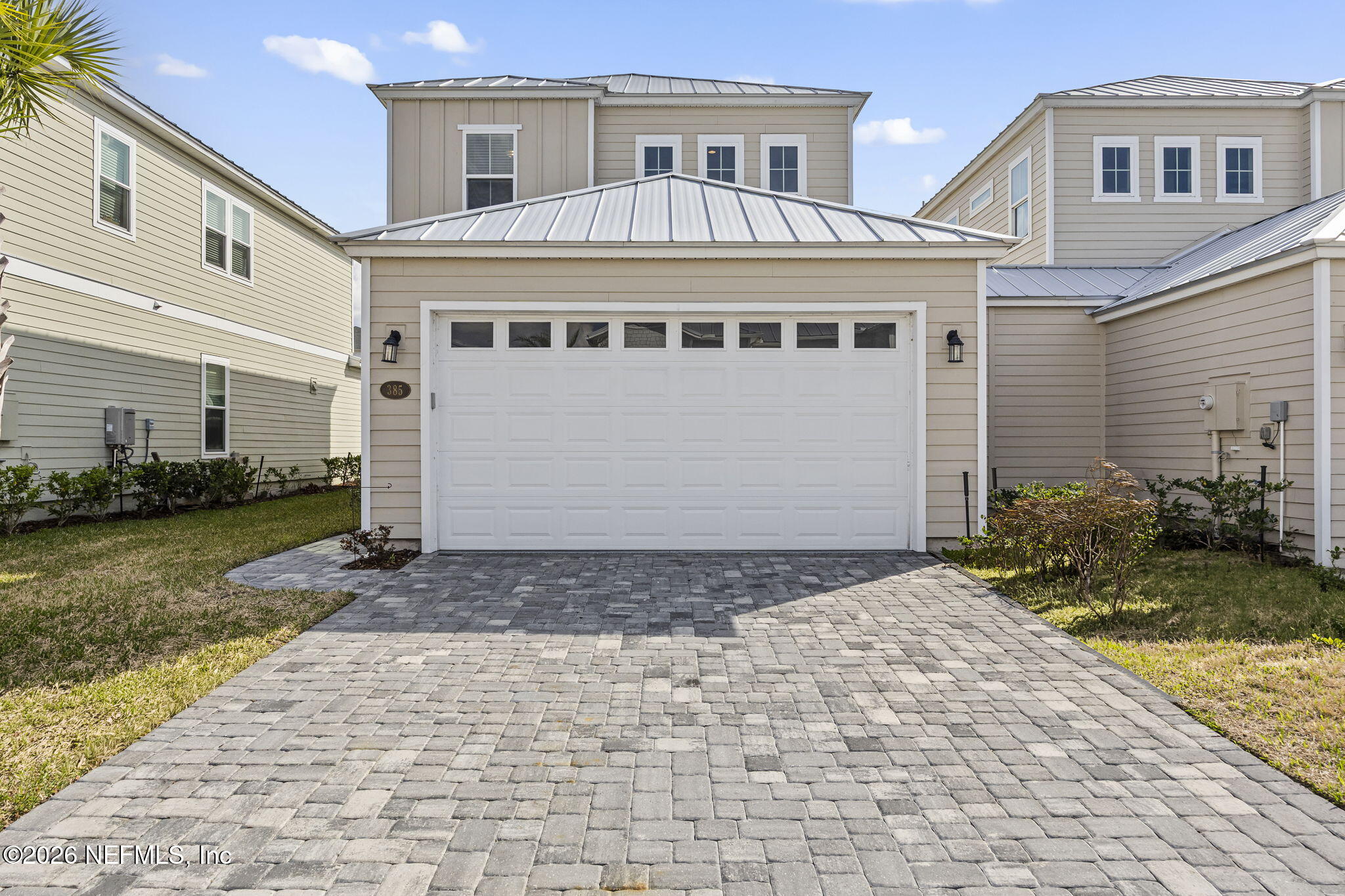 385 Rum Runner Way St. Johns, FL 32259 - Photo 2 of 35 a front view of a house with a yard