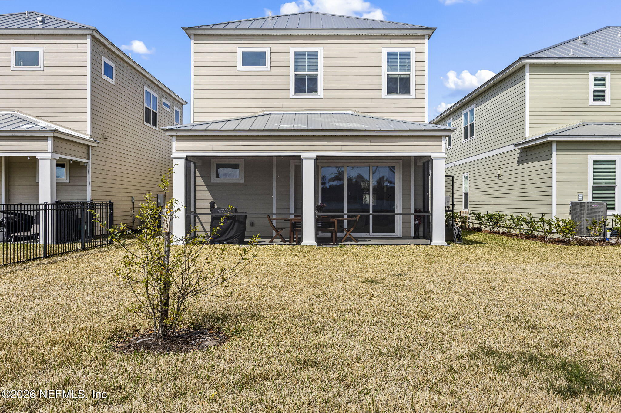 385 Rum Runner Way St. Johns, FL 32259 - Photo 25 of 35 a view of a house with a backyard and porch
