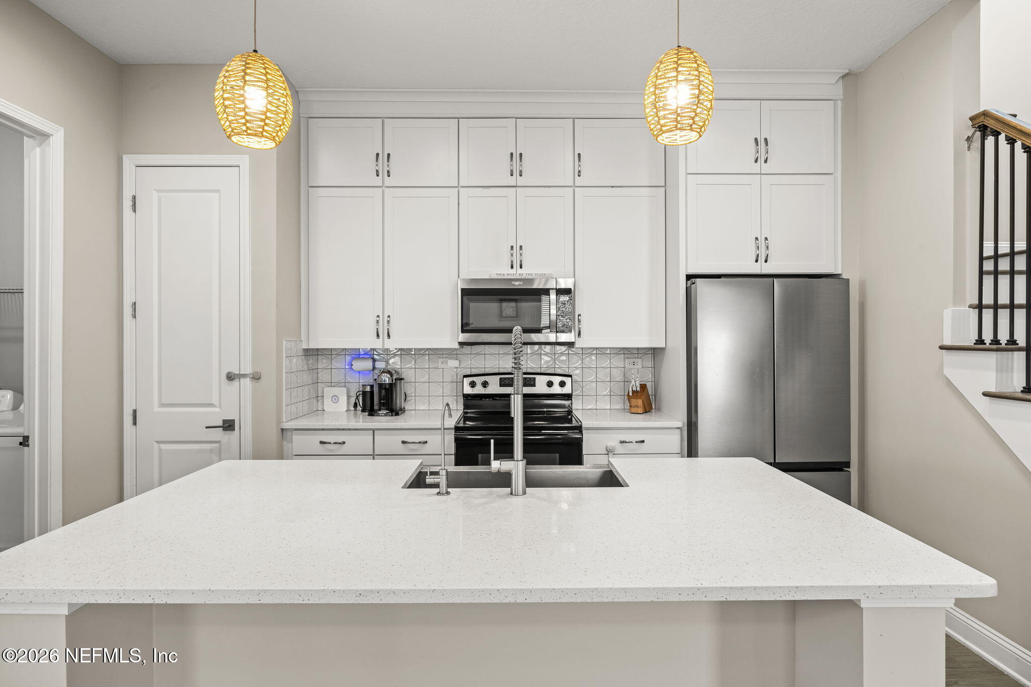 385 Rum Runner Way St. Johns, FL 32259 - Photo 5 of 35 a kitchen with stainless steel appliances a stove a refrigerator and a chandelier