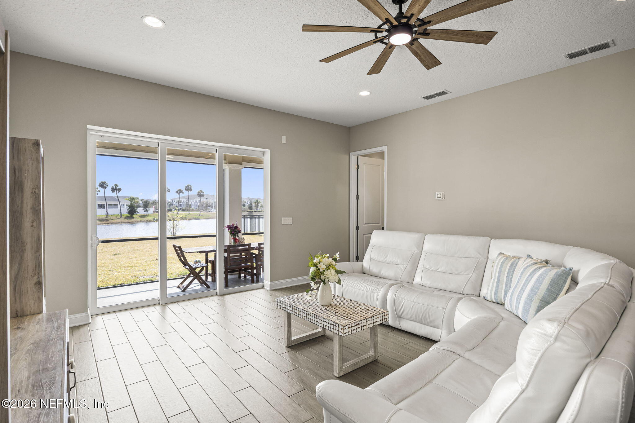 385 Rum Runner Way St. Johns, FL 32259 - Photo 9 of 35 a living room with furniture and a large window