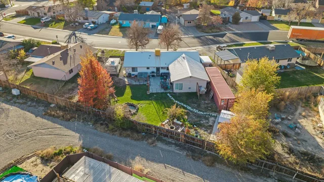 an aerial view of a houses with yard