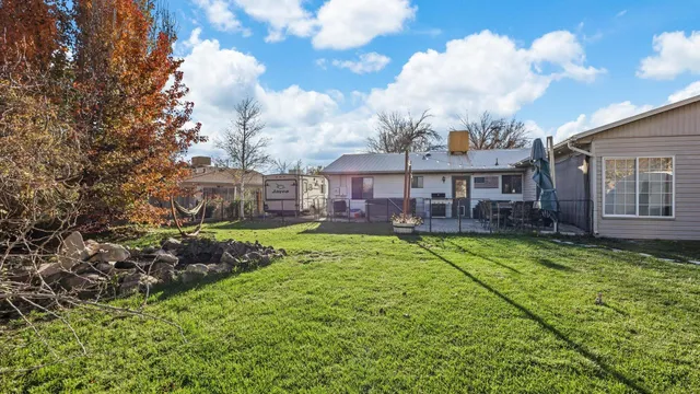 a view of a house with a backyard