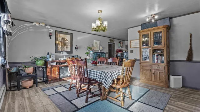 a dining room with furniture and window