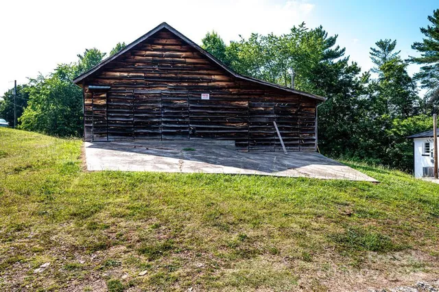 a view of house with backyard and garden