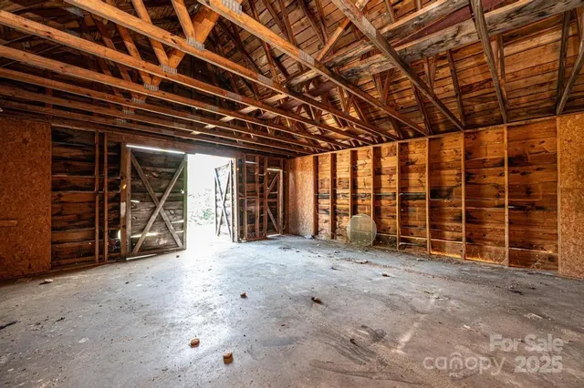 a view of an empty room with closet