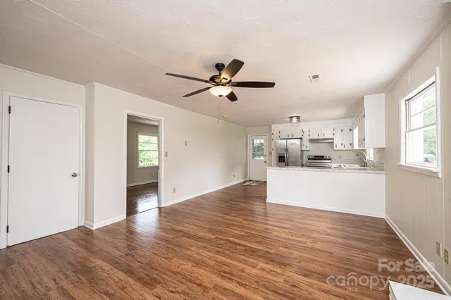 a view of kitchen with wooden floor and window