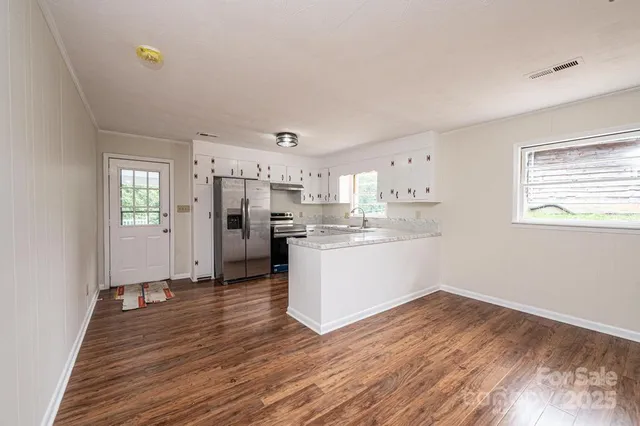 a view of kitchen with wooden floor
