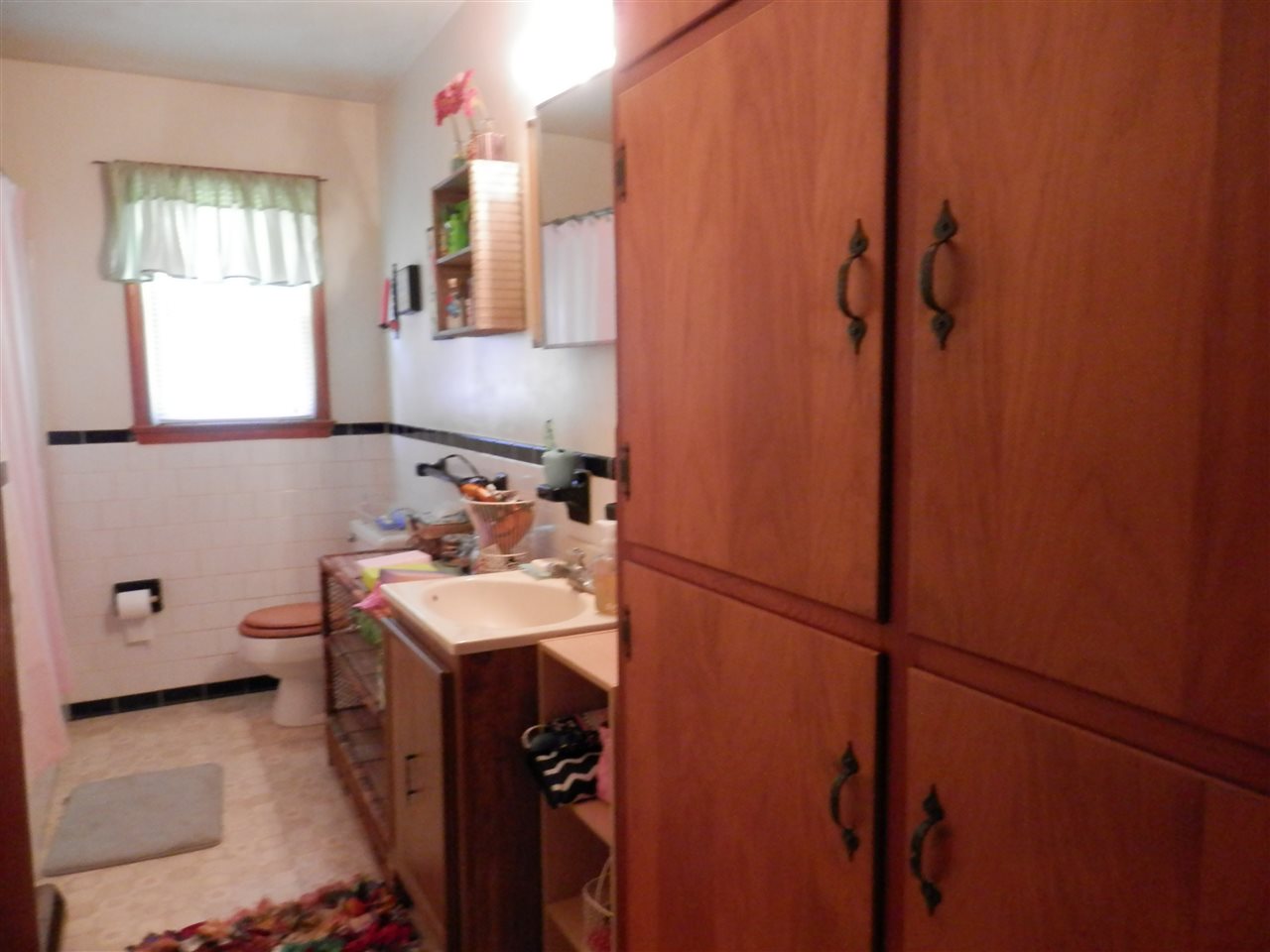 585 Rittenour Road Edinburg, VA 22824 - Photo 13 of 18 a bathroom with a sink and mirror