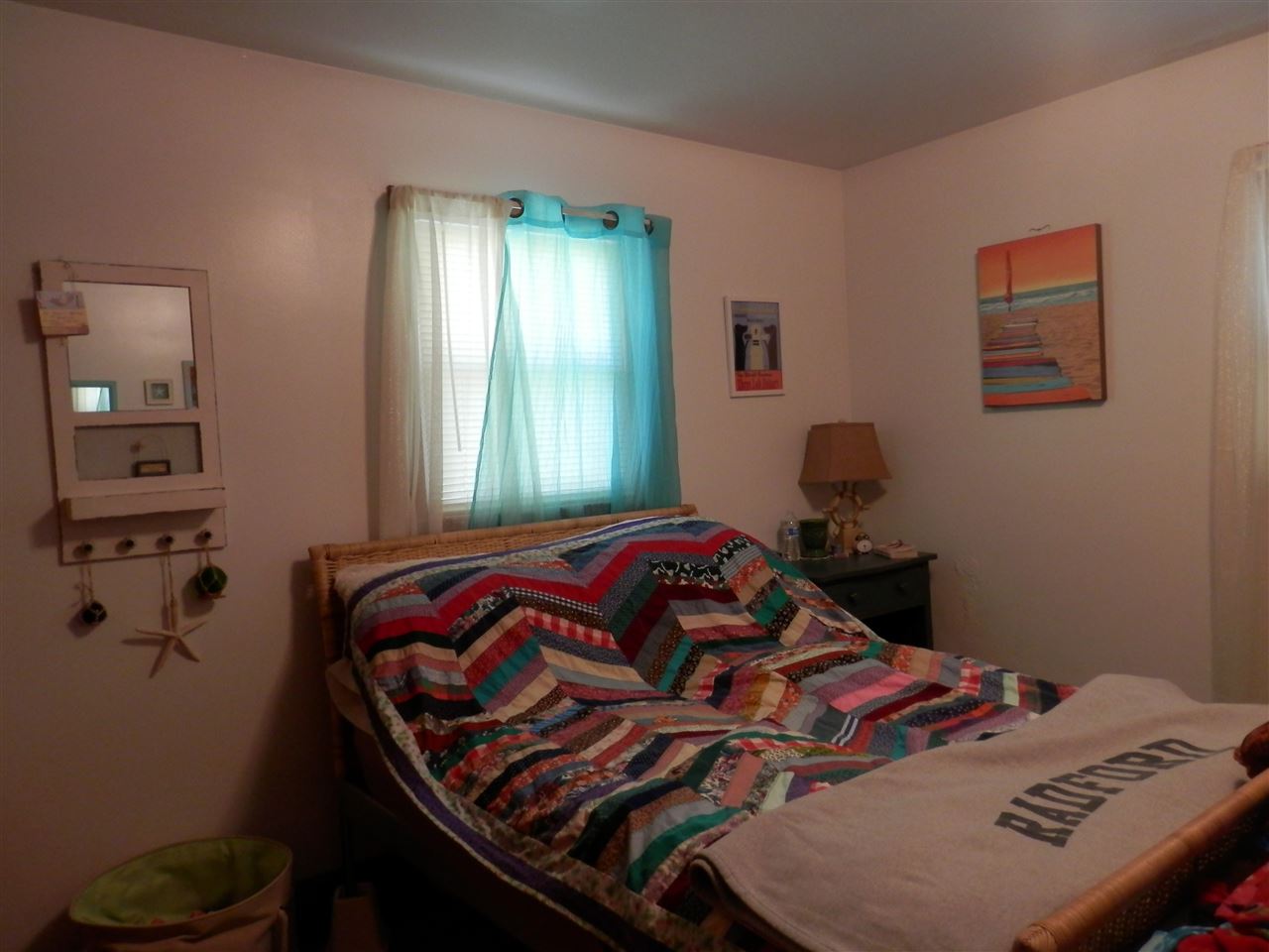 585 Rittenour Road Edinburg, VA 22824 - Photo 15 of 18 a bedroom with a bed and wooden floor