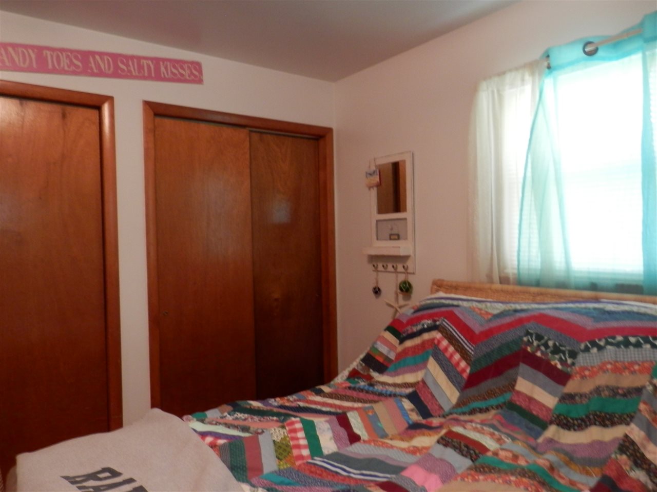 585 Rittenour Road Edinburg, VA 22824 - Photo 16 of 18 a bedroom with a bed and a window