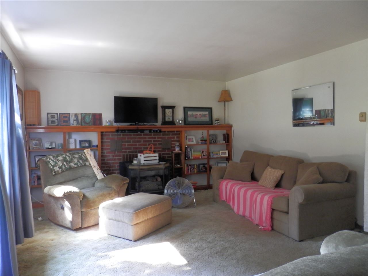 585 Rittenour Road Edinburg, VA 22824 - Photo 8 of 18 a living room with furniture and a flat screen tv