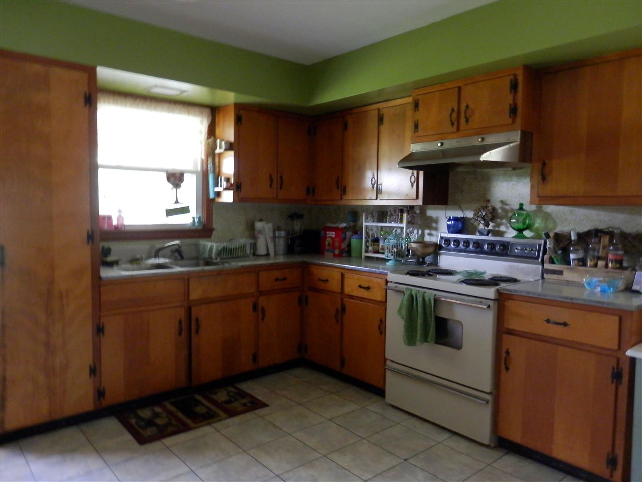 585 Rittenour Road Edinburg, VA 22824 - Photo 9 of 18 a kitchen with stainless steel appliances granite countertop a sink stove and cabinets