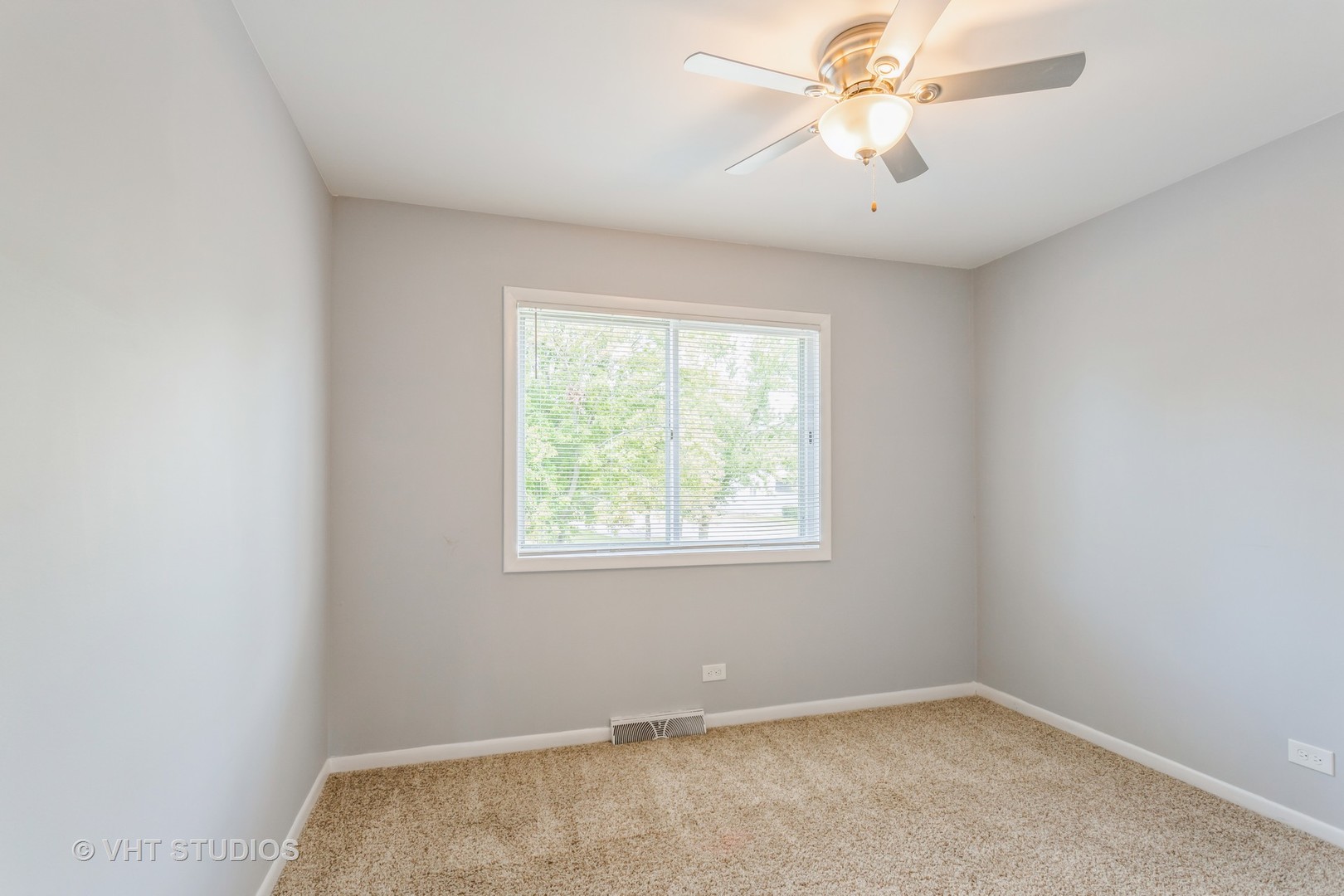167 Roberts Road Bolingbrook, IL 60440 - Photo 12 of 17 an empty room with a window and a fan