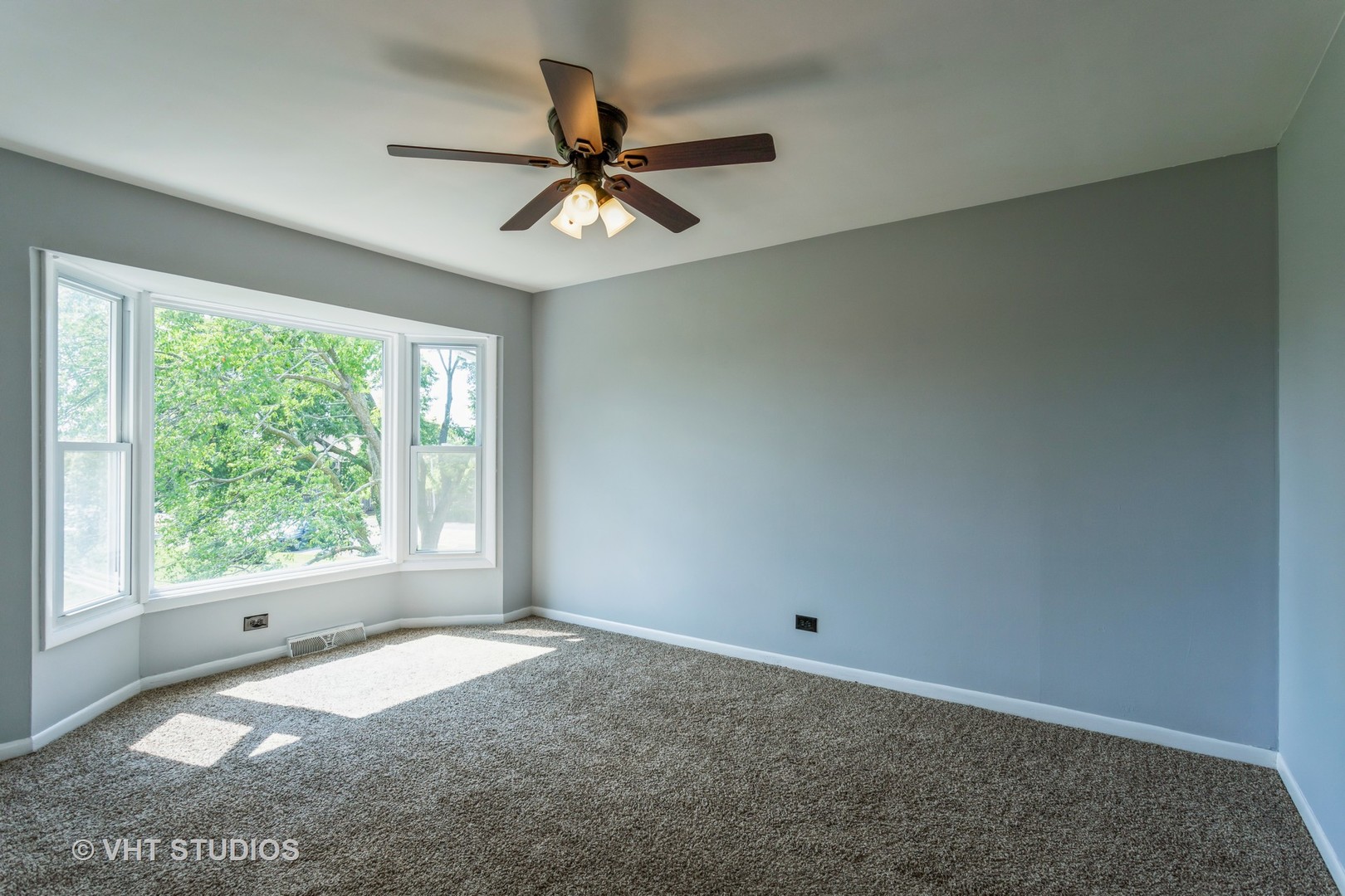 167 Roberts Road Bolingbrook, IL 60440 - Photo 13 of 17 a view of a big room with windows and chandelier fan