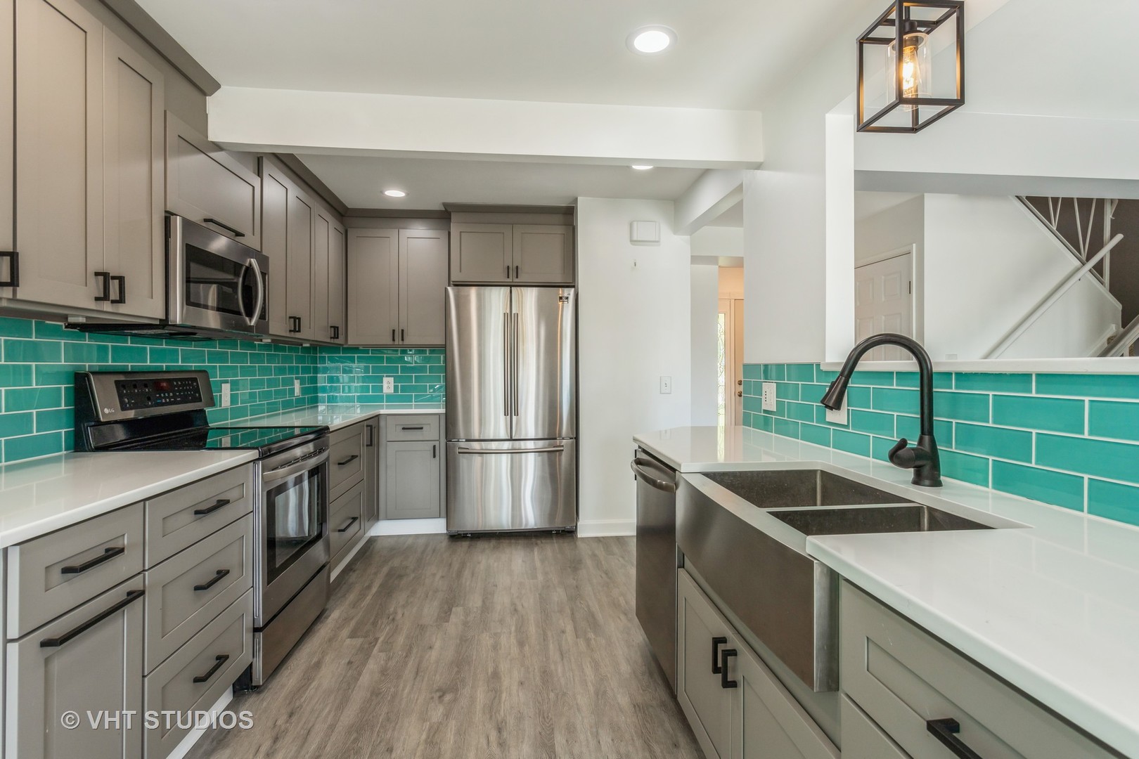 167 Roberts Road Bolingbrook, IL 60440 - Photo 5 of 17 a kitchen with granite countertop a sink a counter space stainless steel appliances and cabinets