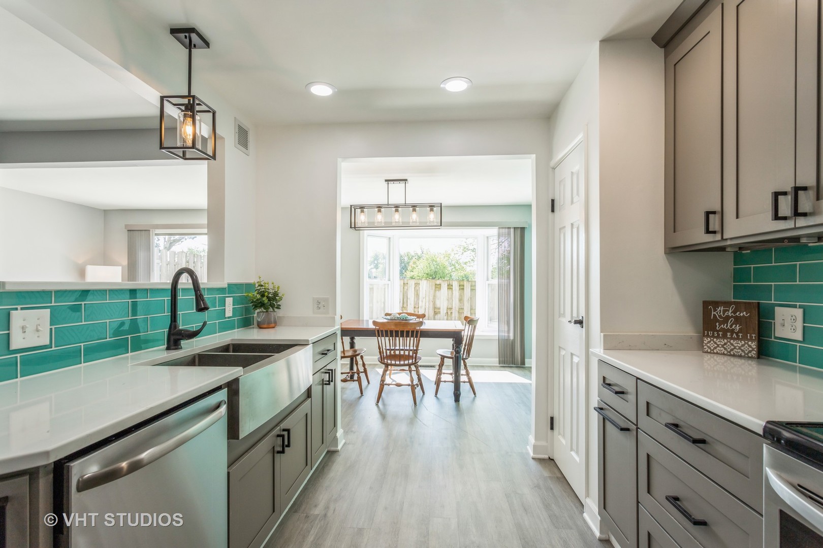 167 Roberts Road Bolingbrook, IL 60440 - Photo 6 of 17 a kitchen with sink cabinets and wooden floor
