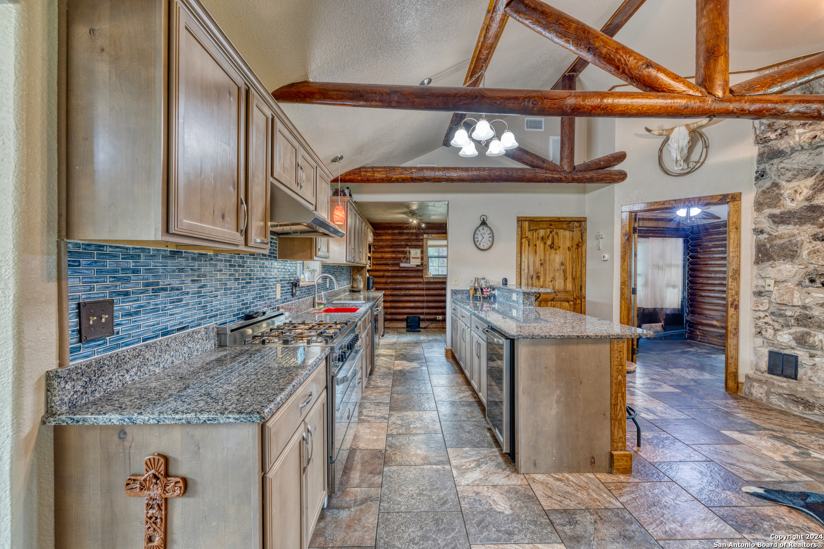 577 Mariposa Concan, TX 78838 - Photo 12 of 39 a kitchen with stainless steel appliances granite countertop a stove and cabinets