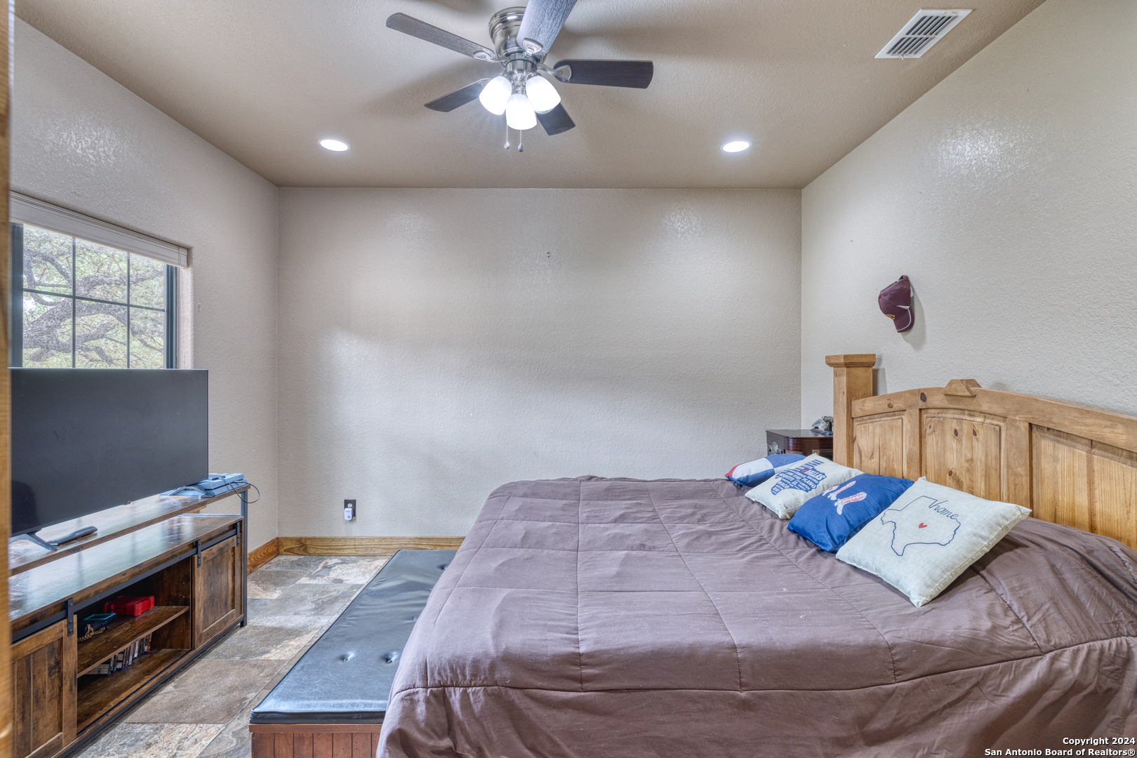 577 Mariposa Concan, TX 78838 - Photo 21 of 39 a bedroom with a bed and a flat screen tv