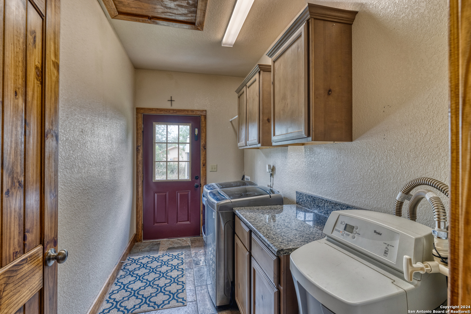 577 Mariposa Concan, TX 78838 - Photo 23 of 39 a utility room with dryer and washer