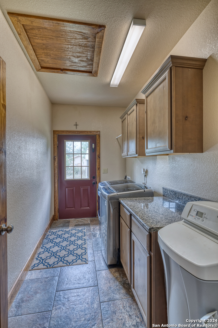 577 Mariposa Concan, TX 78838 - Photo 24 of 39 a kitchen with a sink stove and cabinets