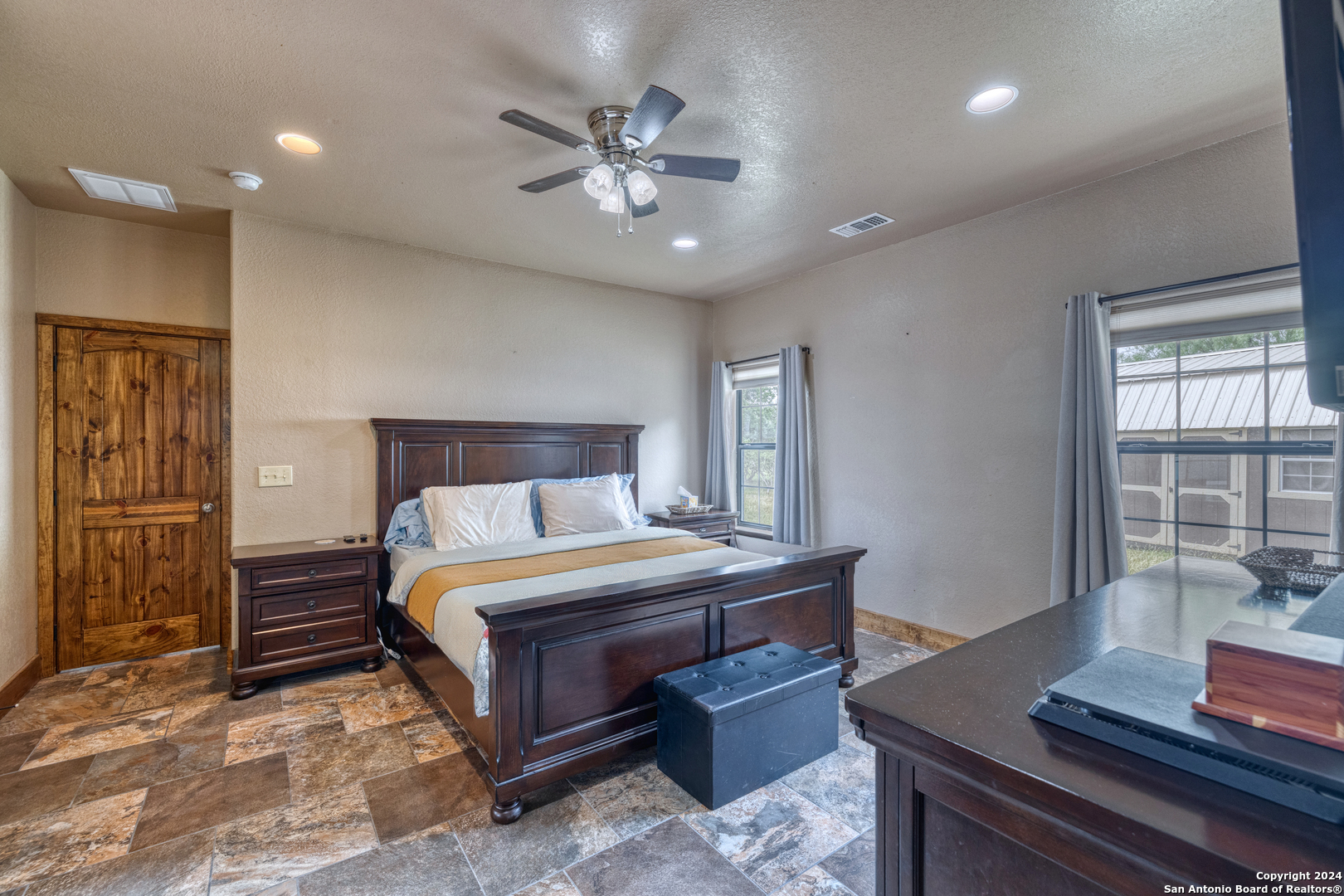 577 Mariposa Concan, TX 78838 - Photo 25 of 39 a bedroom with a bed and a window