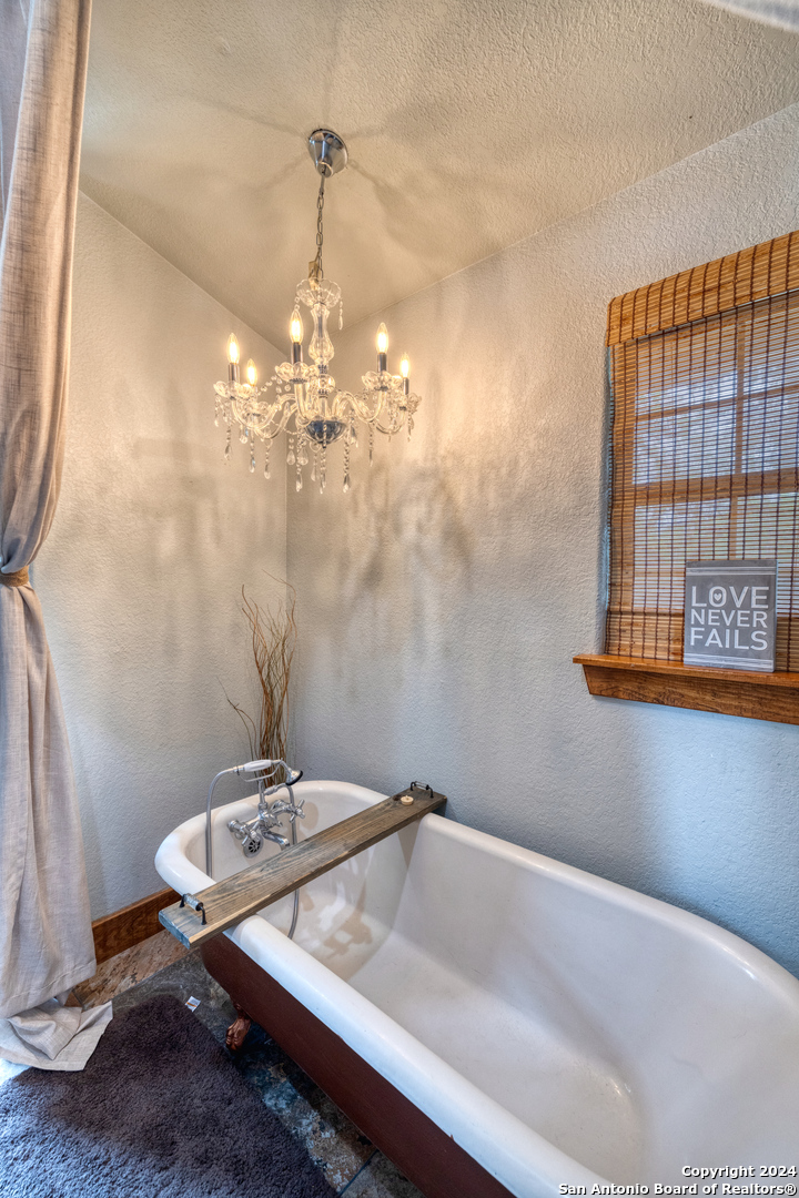 577 Mariposa Concan, TX 78838 - Photo 33 of 39 a bathroom with a sink and a mirror