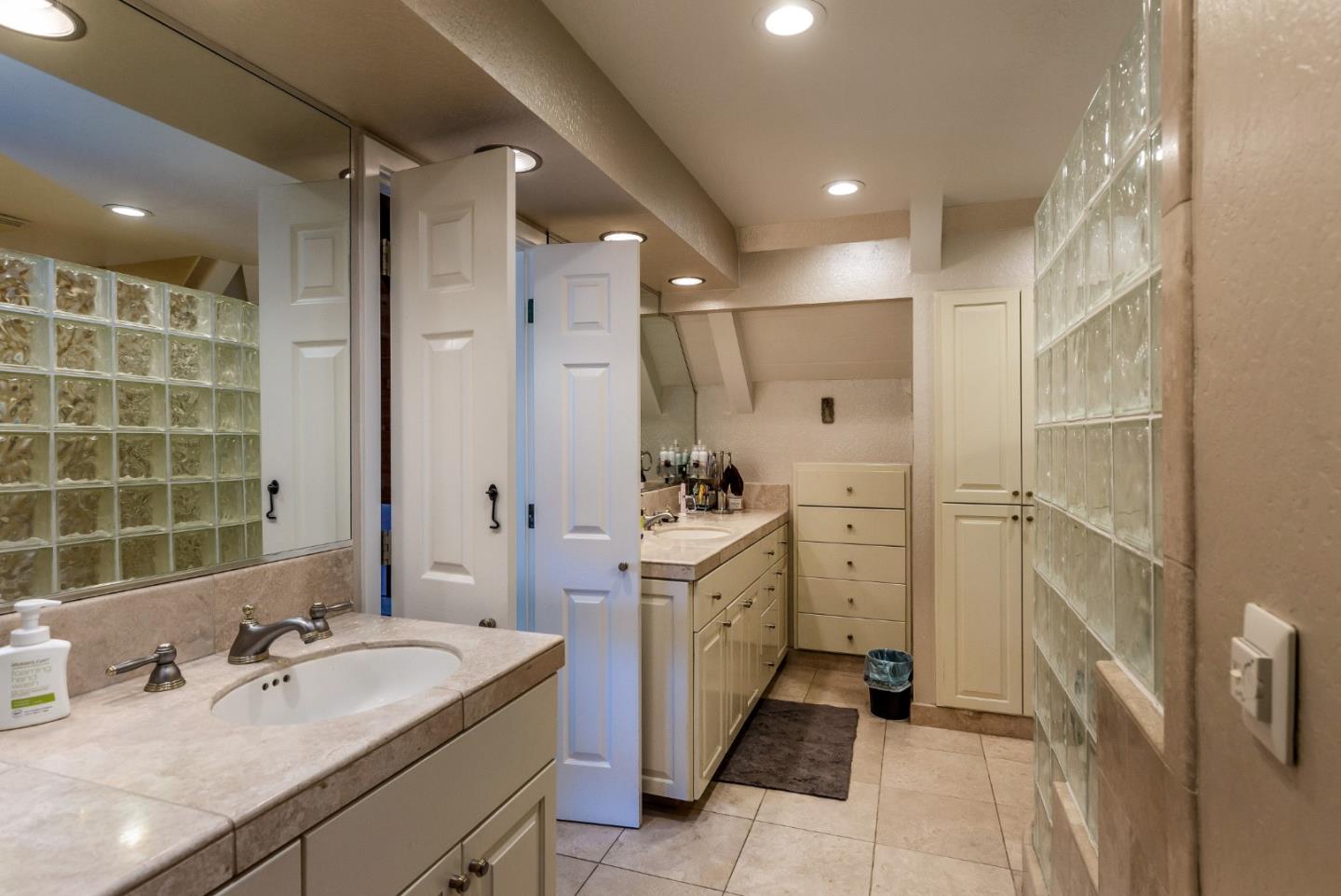 25255 Apple Hill Road Los Gatos, CA 95033 - Photo 16 of 47 a spacious bathroom with a double vanity sink a mirror and a shower