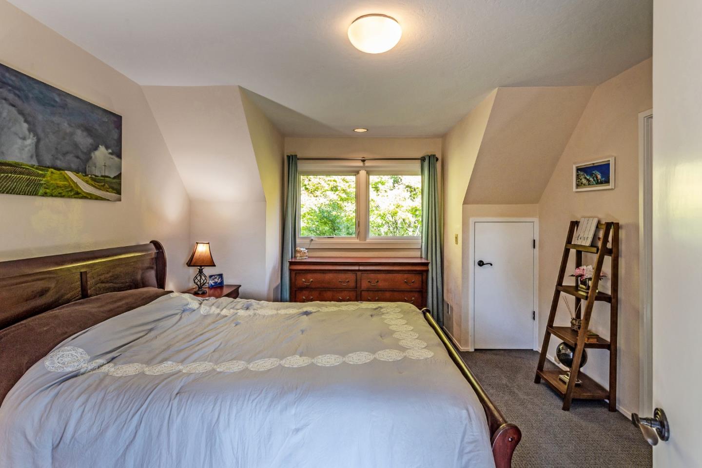 25255 Apple Hill Road Los Gatos, CA 95033 - Photo 18 of 47 a bedroom with a bed and a window
