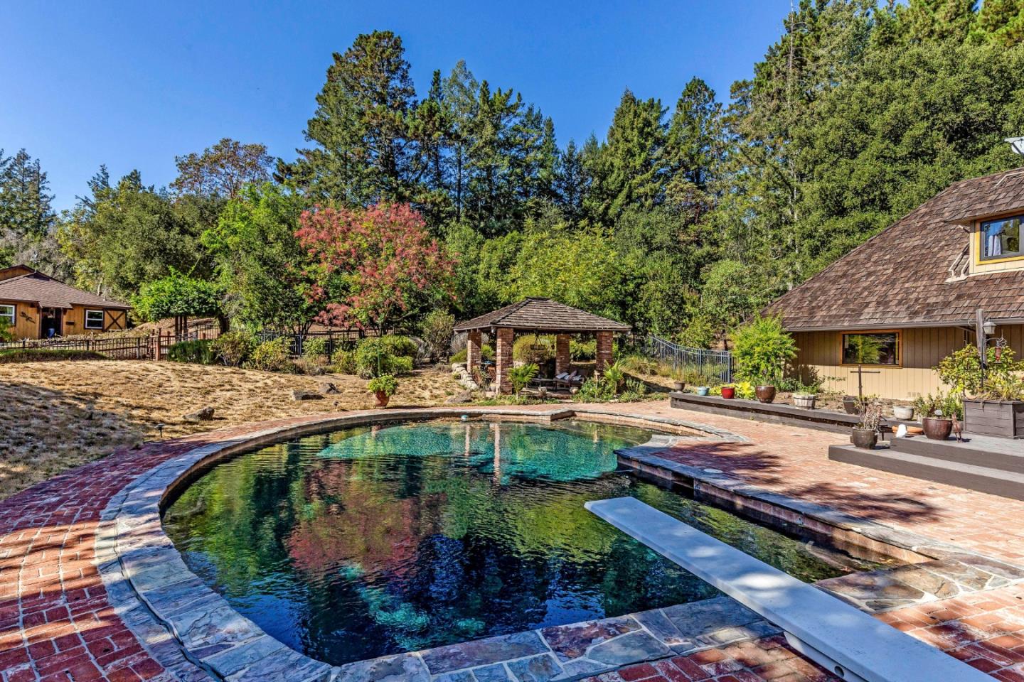25255 Apple Hill Road Los Gatos, CA 95033 - Photo 28 of 47 an outdoor space with seating area and trees