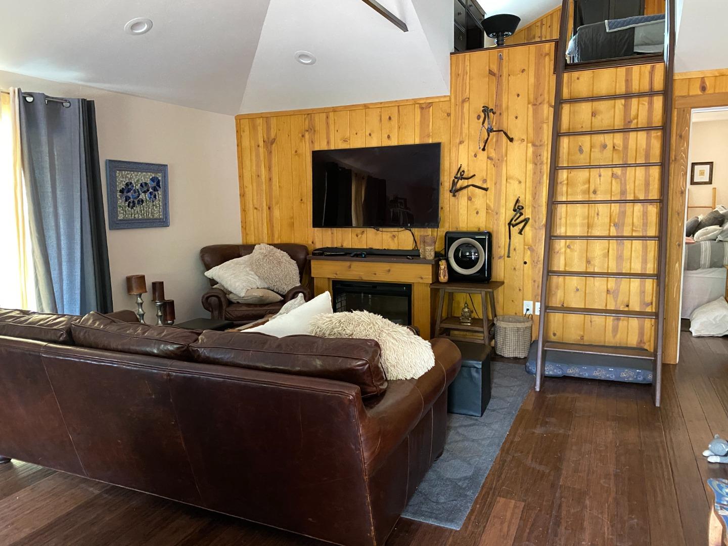 25255 Apple Hill Road Los Gatos, CA 95033 - Photo 37 of 47 a bedroom with a bed and wooden floor