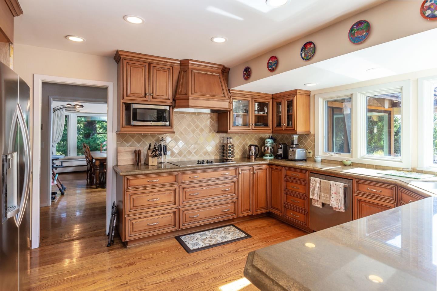 25255 Apple Hill Road Los Gatos, CA 95033 - Photo 6 of 47 a kitchen with stainless steel appliances granite countertop a stove a sink and a refrigerator