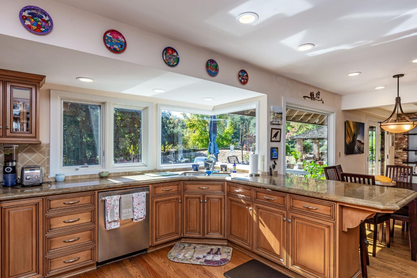 25255 Apple Hill Road Los Gatos, CA 95033 - Photo 7 of 47 a kitchen with lots of counter top space and wooden floor