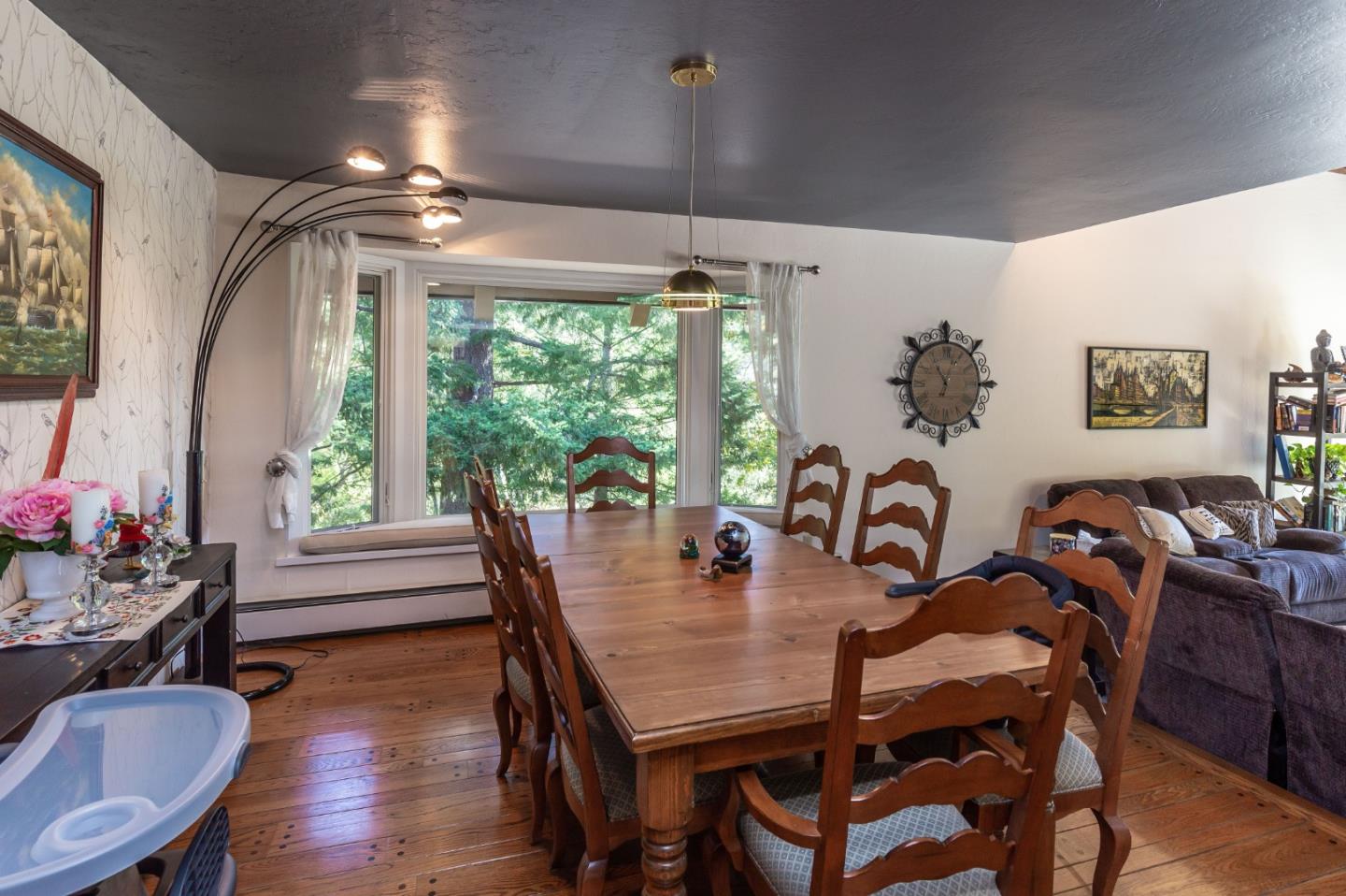 25255 Apple Hill Road Los Gatos, CA 95033 - Photo 9 of 47 a dining room with furniture a chandelier and wooden floor