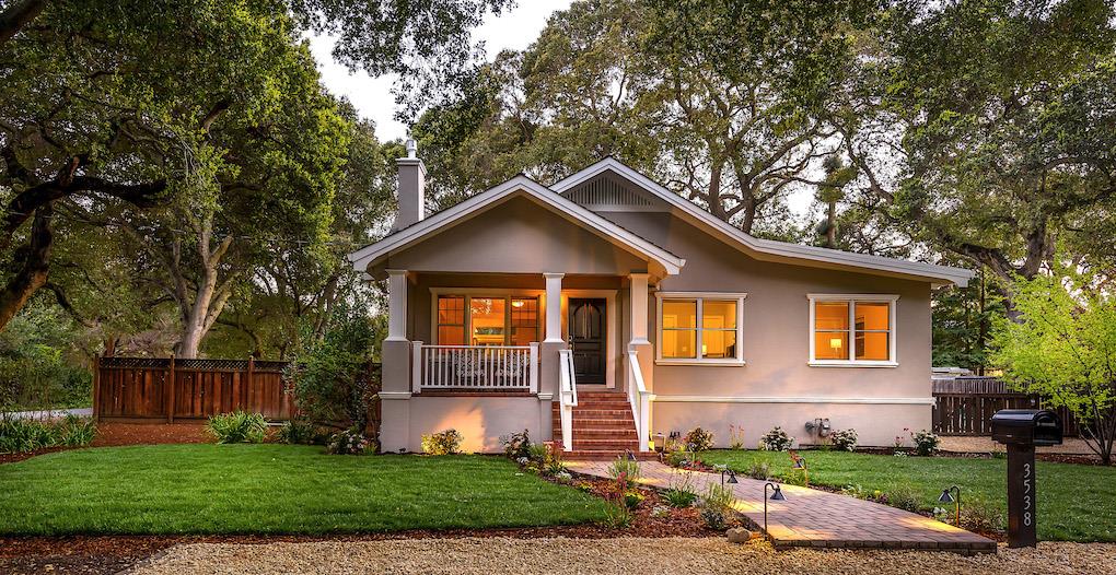 a front view of a house with a yard