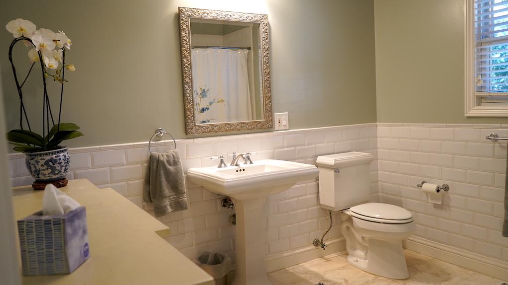 3538 Oak Drive Menlo Park, CA 94025 - Photo 11 of 20 a bathroom with a sink a toilet and a mirror