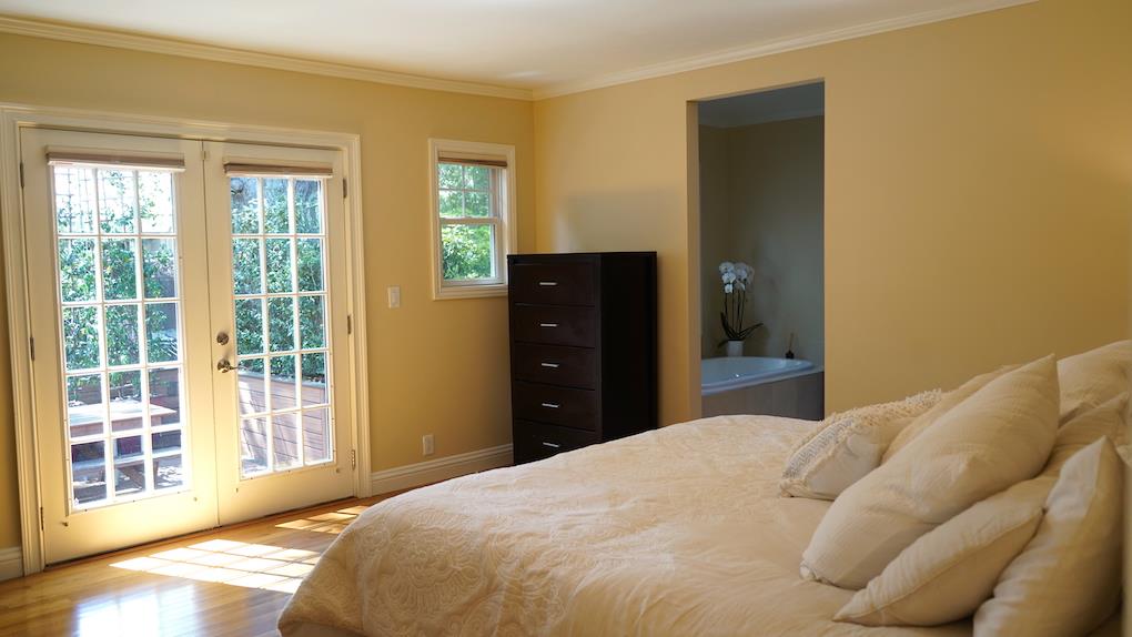 3538 Oak Drive Menlo Park, CA 94025 - Photo 7 of 20 a bedroom with a bed and a large window