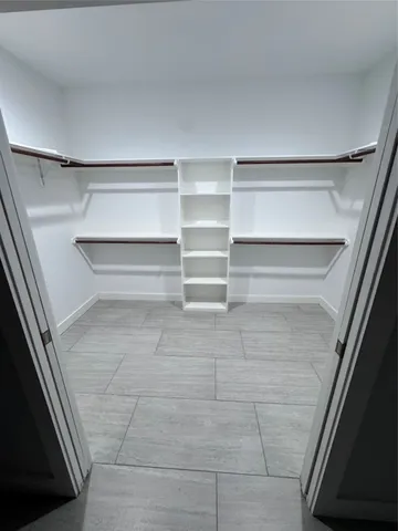 a view of an empty walk in closet