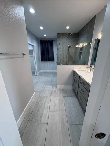 a kitchen with a table and chairs in it