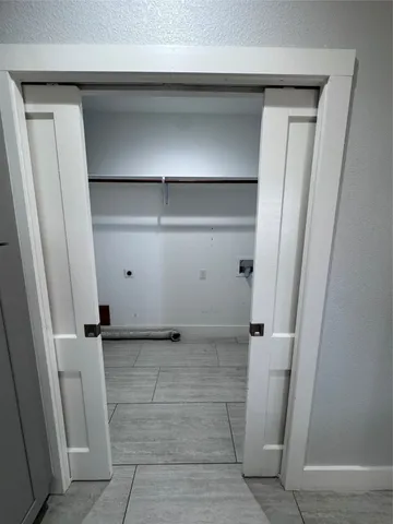 a view of an empty room with a large window