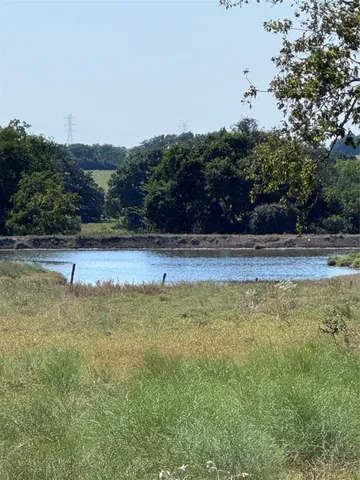 a view of a swimming pool and an outdoor space