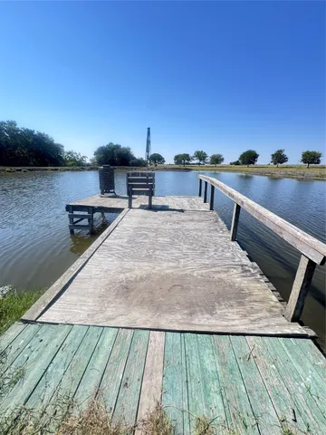 a view of a terrace with wooden floor and seating space