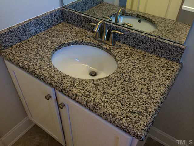 7517 Channery Way, Unit LT34 Raleigh, NC 27616 - Photo 25 of 25 a bathroom with a sink and mirror