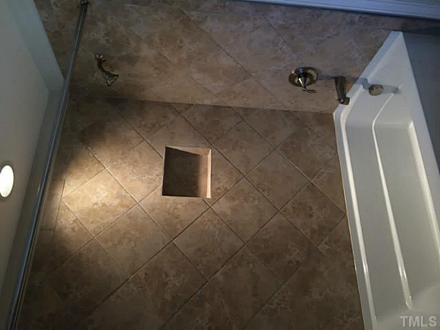 7517 Channery Way, Unit LT34 Raleigh, NC 27616 - Photo 10 of 25 a bathroom with a shower and a toilet