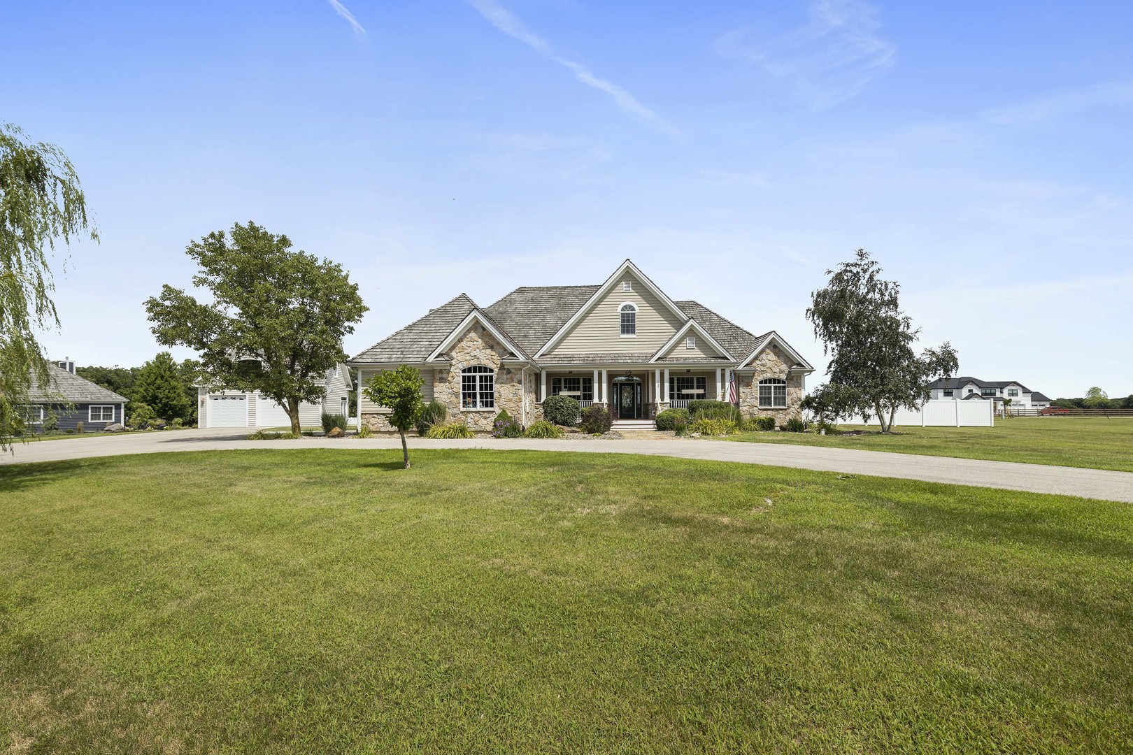 a front view of a house with a garden